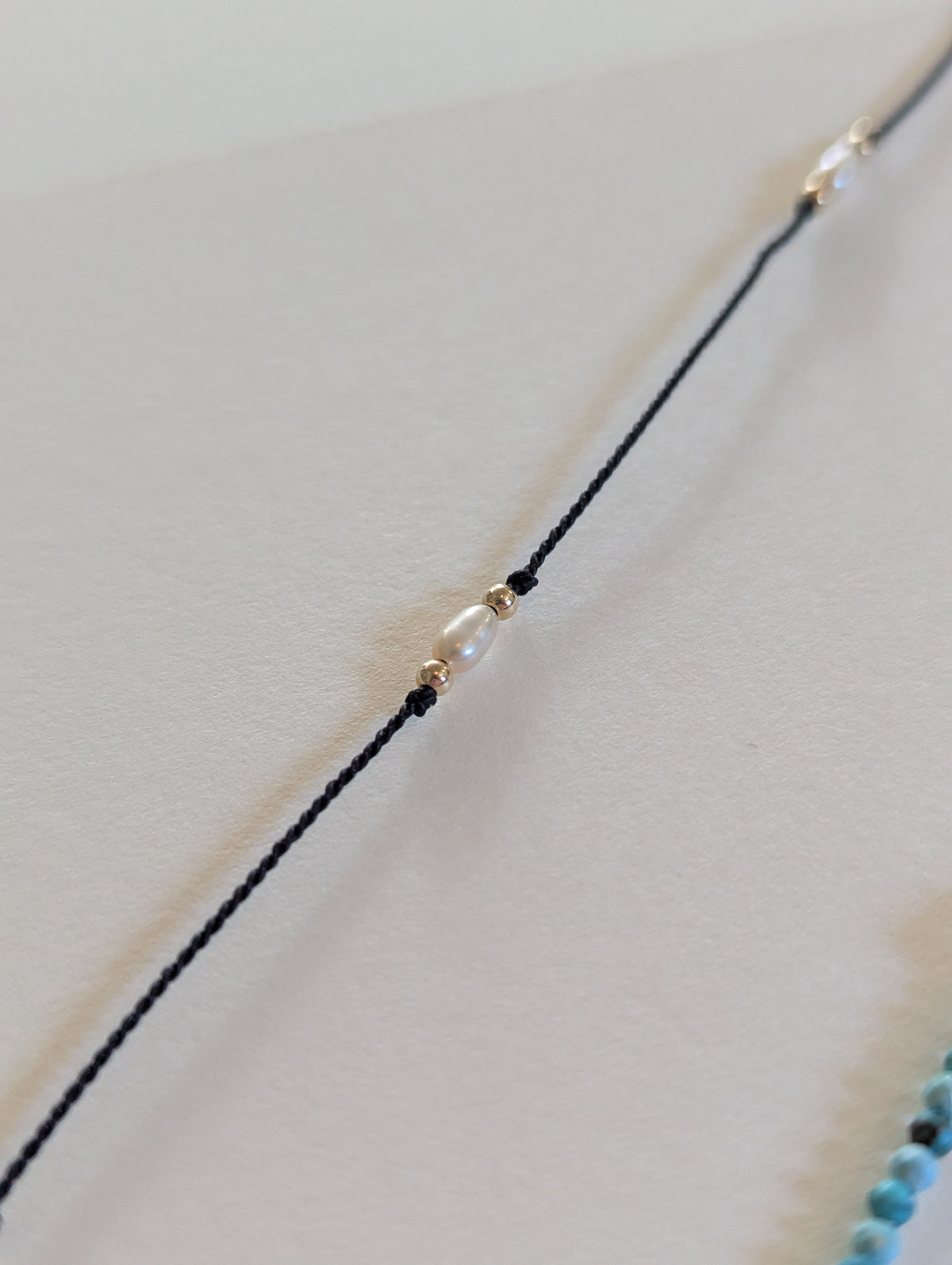 Pearl and Black Silk Bracelet by giantlion